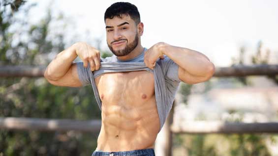 Bodybuilding hunk Matteo tells you a little bit about himself and shows off his impressive physique. Even more than his massive arms and cut chest, Matteo's got a huge muscle hiding under his clothes.