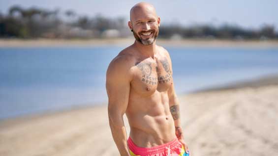 Shaven-haired, muscular Vin hits the beach, jogging along the boardwalk and riding his scooter down the road. This bearded, inked hunk likes to get playful as he rubs his bare chest, plucking a blossom and...