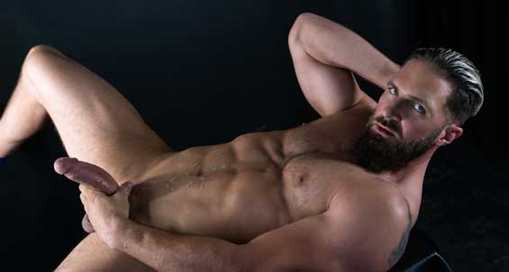 Bradley Virile is a bearded and hairy hunk of a man. Just as he tears open his undershirt, he can easily tear an ass in two. His bulging pecs, heavy cock, and Alpha attitude rival the manliest of men.