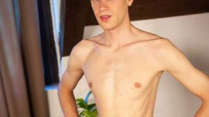 Petr Solka is aged 22. He lives in Prague and is self-employed. In his spare time he enjoys sports, jogging and soccer. He looks great as he sits on the bed and does his interview.
